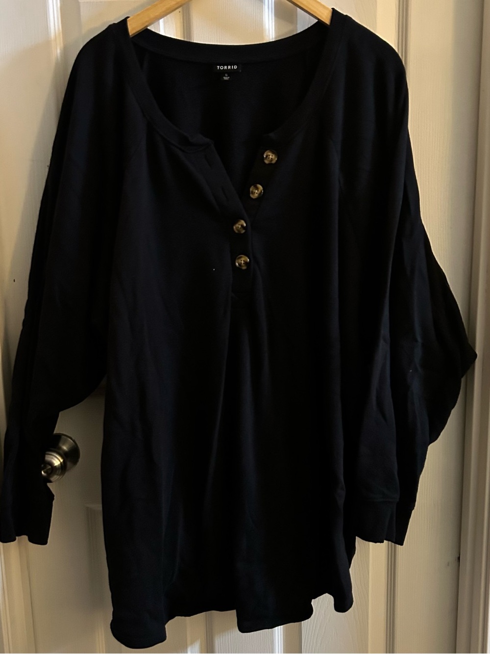 torrid black henley-style long sleeve top with tortoiseshell buttons